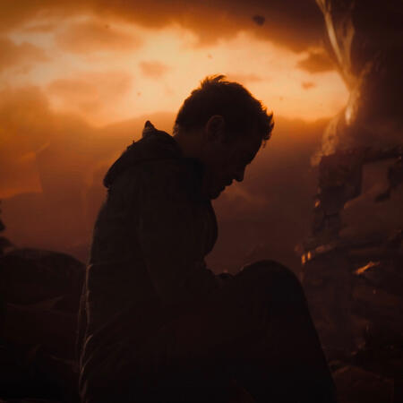 click this image for an mcu quote. the image shows tony stark sitting defeatedly on titan, silhouetted against the orange sky.