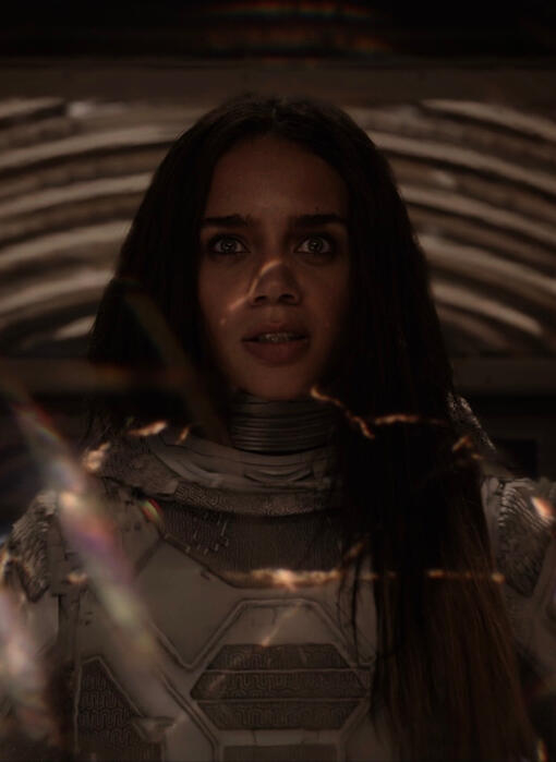 click this image for an mcu quote. the image shows ava starr standing in her quantum chamber as light washes over her.